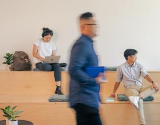 employees sitting in stadium seats